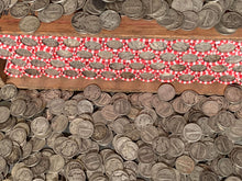 Load image into Gallery viewer, VINTAGE RED & WHITE BANK ROLL WITH A SILVER DIME SHOWING